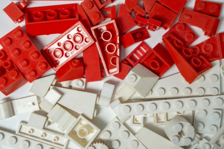 Red and white logos in pieces